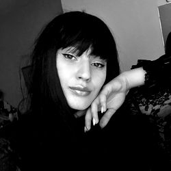 Anastasia, a captivating OnlyFans model in dark clothing