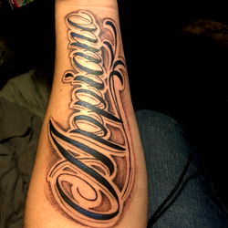 Tattoo of a man's arm with the word 'Apollo' inscribed