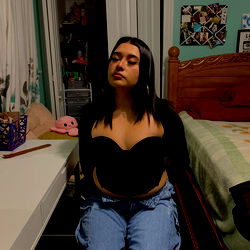 Maria Carrasco: An OnlyFans Model from Chicago, Sitting in Her Bedroom