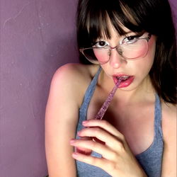 Onlyfans Model Pataprincess: Striking a Playful Pose with Pink Drink