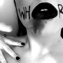 Makeup artist Annabelle Myers showcasing dramatic eyelashes and intense lip artistry