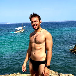 Strongman Model AsstonXXX Posing at a Beachfront Location