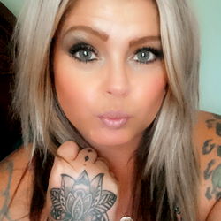 Tattooed Vixen, Striking a Pose with Tattoos and Piercings
