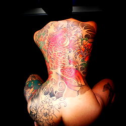 Stunning Tattoo Artist with Vibrant Body Art