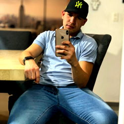 Young Man Posing for Selfie in Jeans