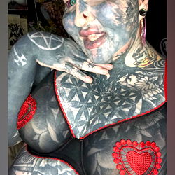 Farrah Flawless: A Gothic Tattoo Model with a Red Heart and Pink Lips