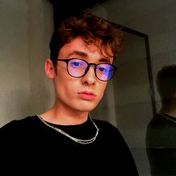 Andrei-Marius, A Young Model with Short Hair and Glasses