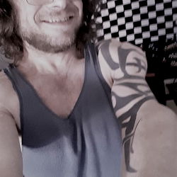 Awkward Selfie of a Man with Tattoos