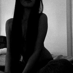 Aroua, an OnlyFans Model with Long Hair and Black Tattoo on Right Arm