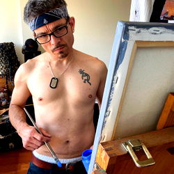 Shirtless Artist in Studio