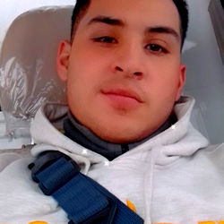 Alejo, an OnlyFans model, takes a selfie with the car seat