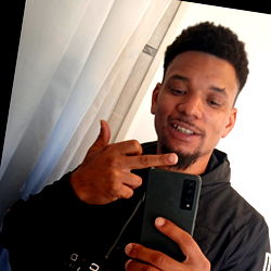 A Young Man Posing with a Phone