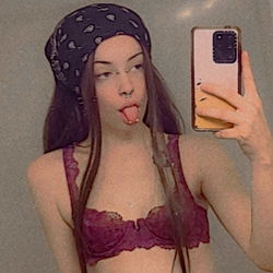 Peaches, an OnlyFans model in a bra and headscarf