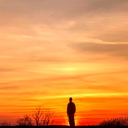 A Silhouette of a Person at Sunset