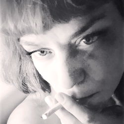 A Candid Shot of Mandolin, The Smoking Woman with Short Hair