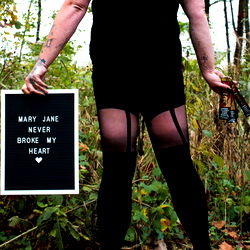 Tasha D, Onlyfans Model Poses with Mary Jane Sign
