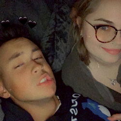 Two people enjoying a cozy moment in the dark