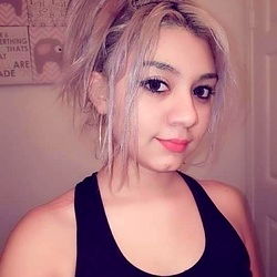 Mason in Sports Bra and Earrings, Playful Selfie with Exercise Equipment