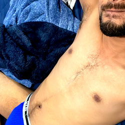 Adult model Ali's seductive pose on bed