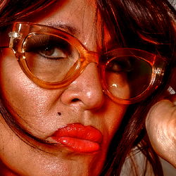 Chic Woman in Orange Lipstick and Glasses