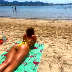 Amberleighreid on the beach in a yellow bikini