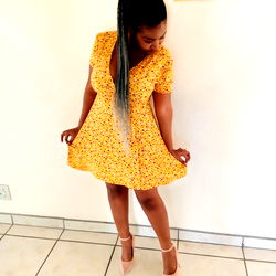Fashionable Young Woman in Yellow Dress and High Heels