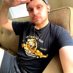 Andy, a Providence, RI resident, strikes a pose on the couch