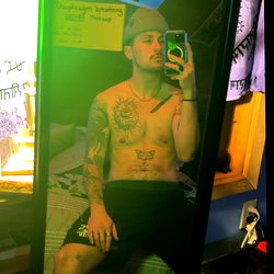 Fashionable Fitness Model Alex Rowe Taking a Selfie