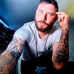 A Young Adult Male, Kris Stoff from CT, in a Tattooed Skin, Showing off his Arm Tattoos