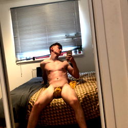 Blaster! Shirtless in a room with a large mirror.