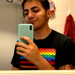 Jordan - A Smiling Model Taking a Mirror Selfie