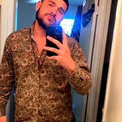 Anthony, a man from Idaho, posing in a bathroom mirror