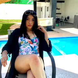 Tifanny Model Posing on Patio Chair