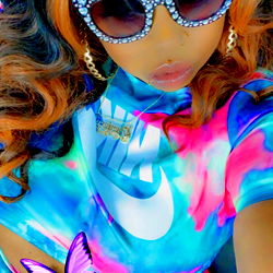 Niecy, a vibrant and playful individual, shares her colorful life on OnlyFans