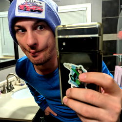 Model Bash with Cellphone in Bathroom