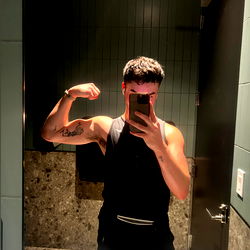 NYC Grad Student Flexes Muscles in Gym Mirror
