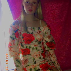 Amber in Floral Jumpsuit at Window