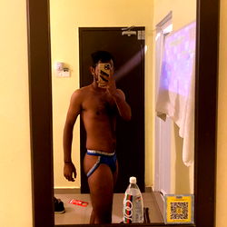 AbamBuluss Model in Bathroom Mirror, Capturing His Shirtless Reflection