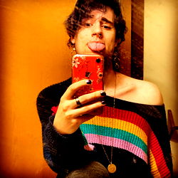 Awesome model Cat with a vibrant rainbow sweater and phone in hand