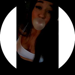 Anna, a social media influencer and model, poses with bubble gum and a moon