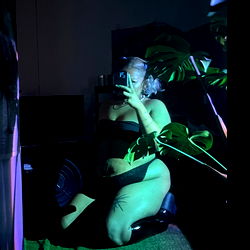 OnlyFans Model Taking Selfie in a Chair