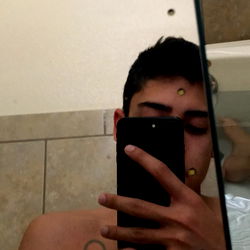 A Model's Reflection in a Mirror